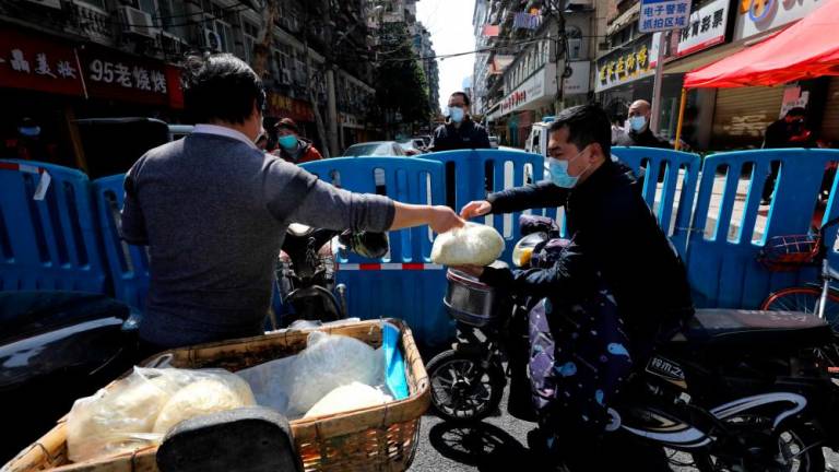 Na Kitajskem spet samo »uvoženi« primeri okužb