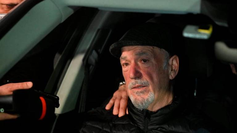 Našli žensko truplo v vreči