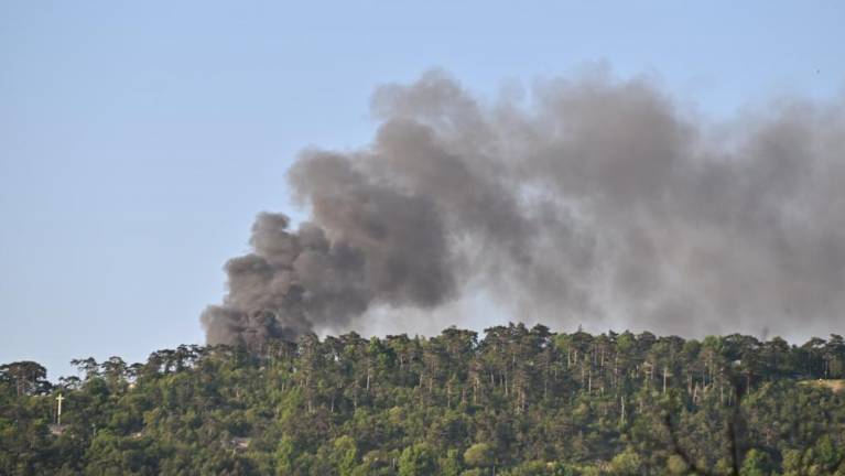 Eksplozije in požar v openskem kampu