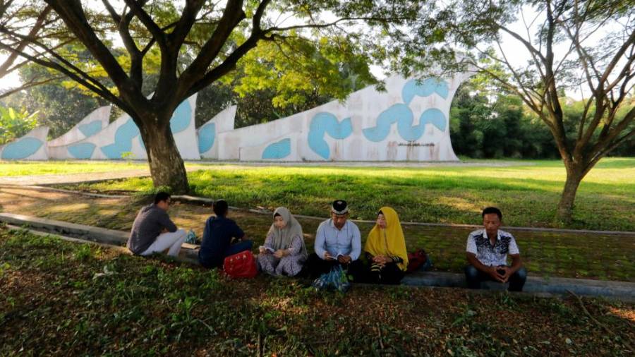 Spominjajo se cunamija, ki je terjal 230.000 življenj (fotO)