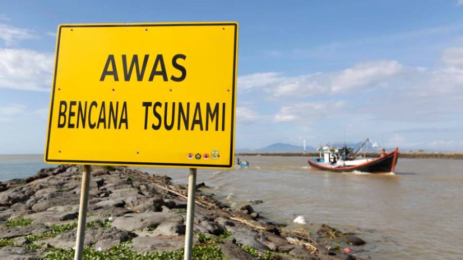 Spominjajo se cunamija, ki je terjal 230.000 življenj (fotO)